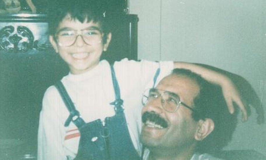 Sohrab sits with his father Mohammad Mokhtari