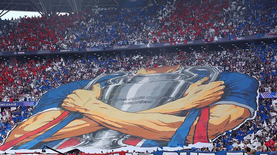 The Paris St-Germain fans unveiling a tifo