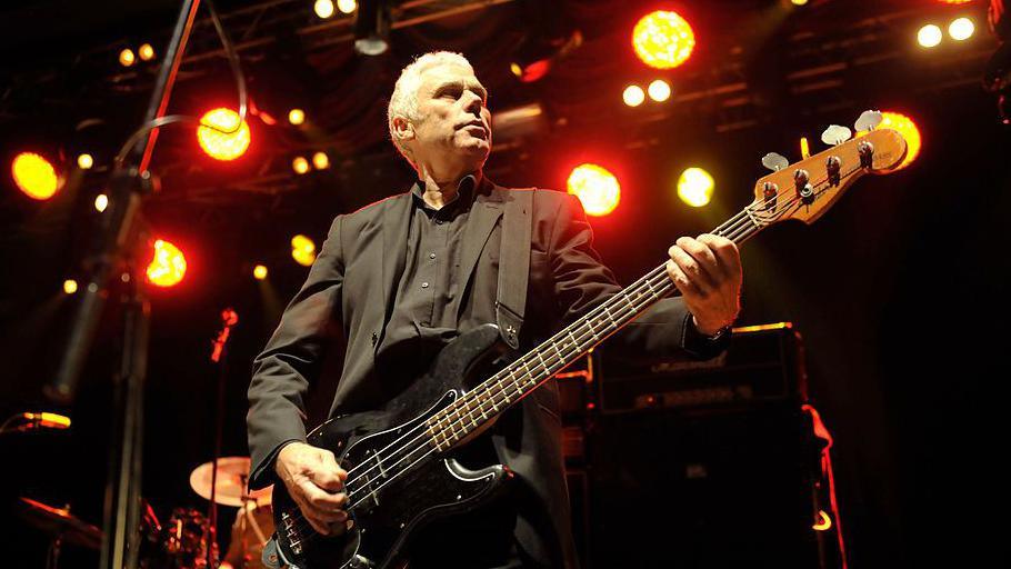 Dr Feelgood bass player Phil Mitchell on stage