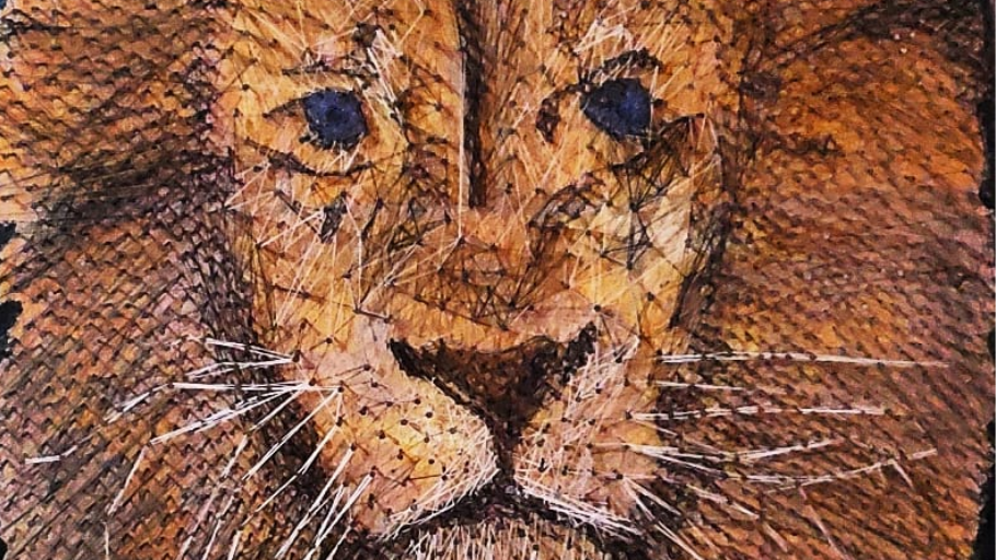 Lion's face with blue eyes and whiskers