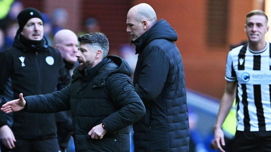 St Mirren's Stephen Robinson celebrates as Philippe Clement exits