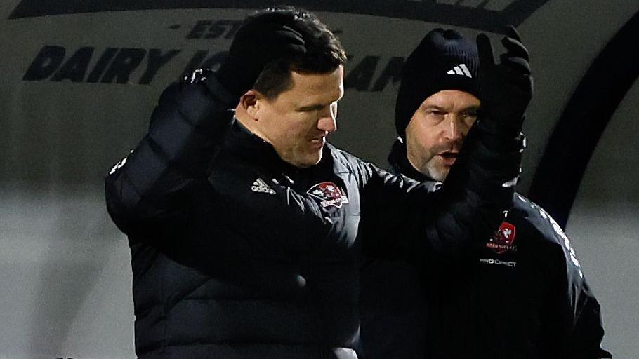 Gary Caldwell pictured, throwing his arms in the air