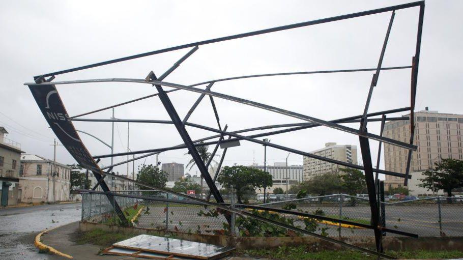 A partially collapsed hoarding frame in Kingston