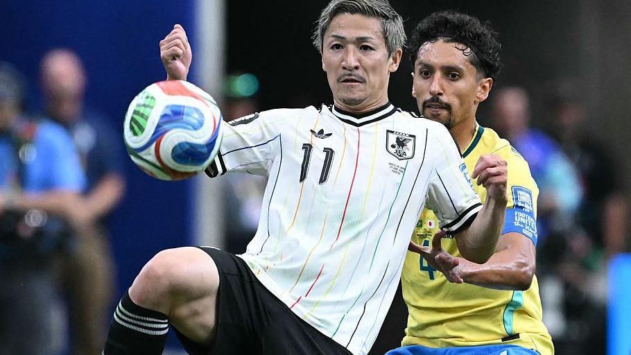 Japan's Daizen Maeda holds off Brazil's Marquinhos