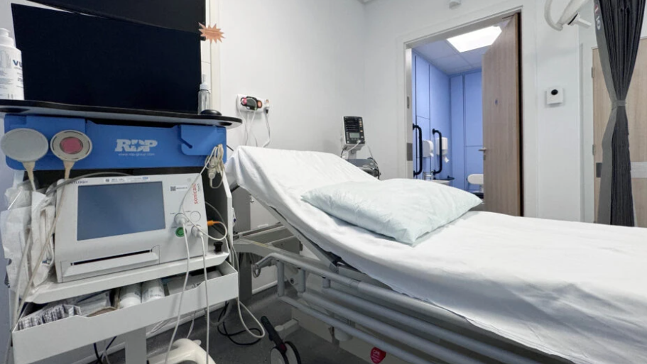 Bed in hospital maternity ward