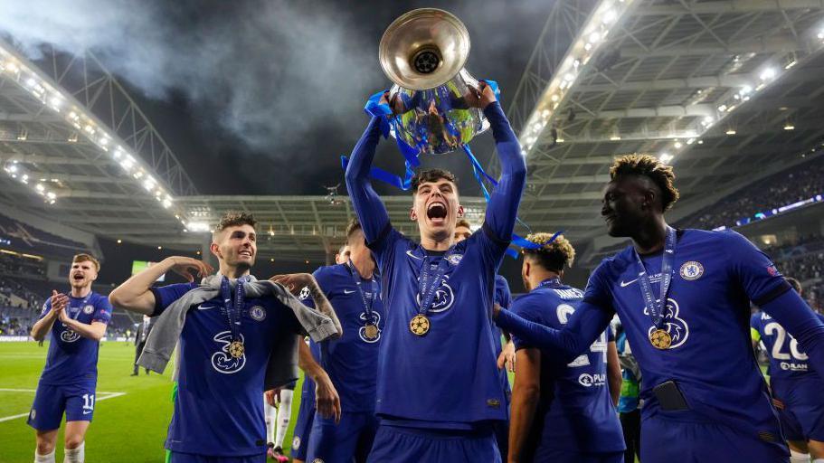 Kai Havertz of Chelsea celebrates with the Champions League Trophy following their team's victory during the UEFA Champions League Final between Manchester City and Chelsea FC