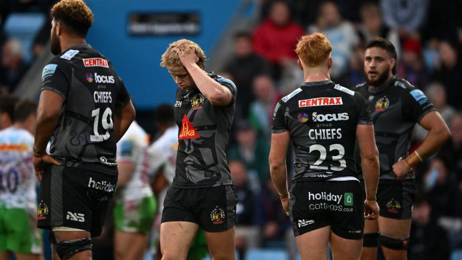 Exeter players look dejected during the game against Harlequins