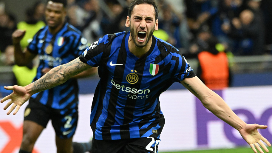 Inter Milan's Hakan Calhano celebrates scoring against Barcelona in the Champions League