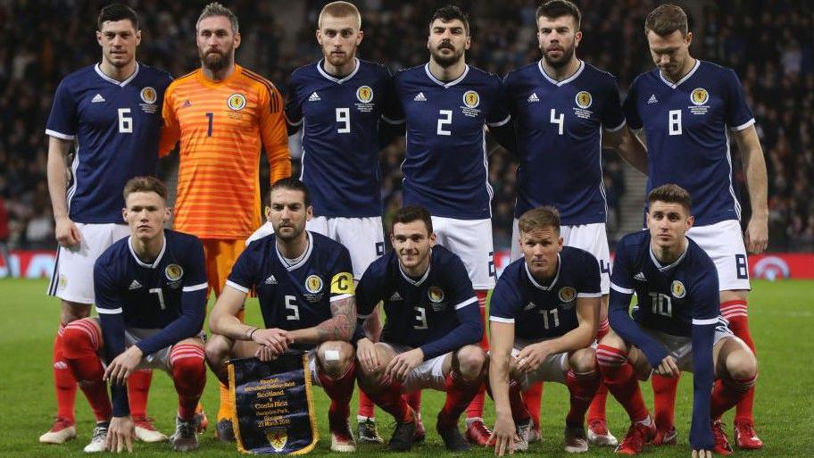 Oli McBurnie (nine) lines up with Scott McKenna (six) ahead of their international debuts for Scotland