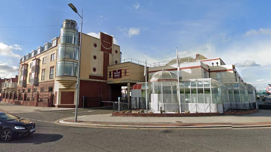 The hotel with large round windows. 