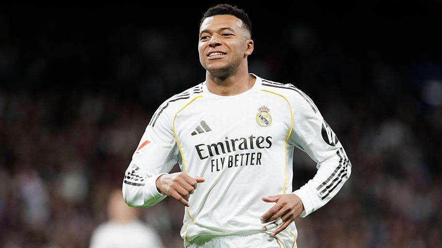 Kylian Mbappe celebrates scoring from the penalty spot for Real Madrid against Sevilla