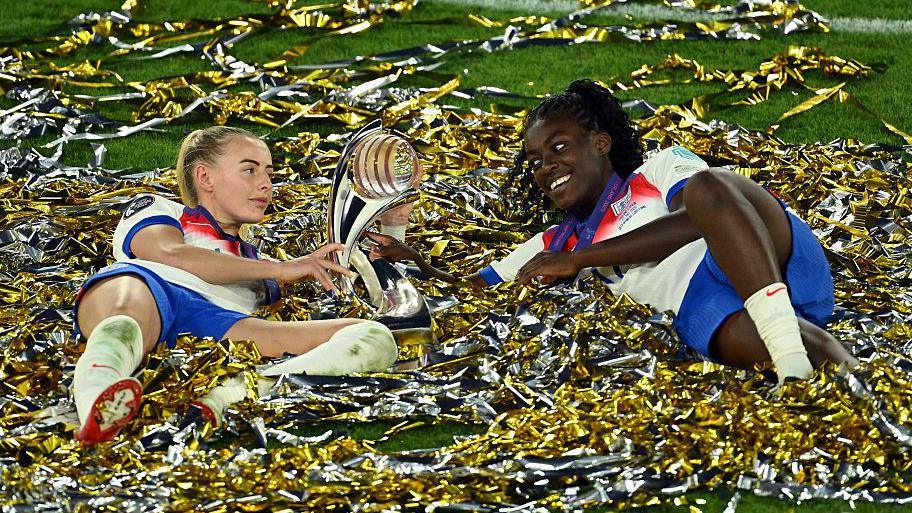 Michelle Agyemang of England leaves the game injured on a stretcher