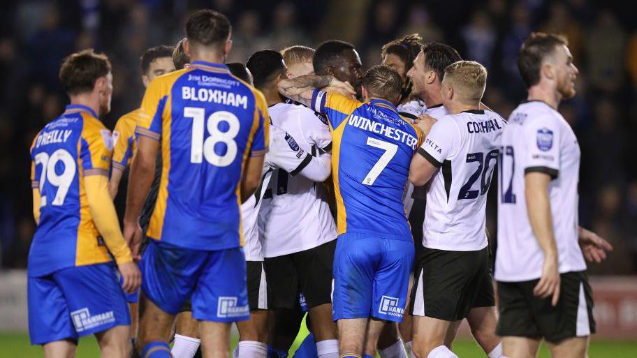 Shrewsbury Town and Birmingham City players square up to each other 