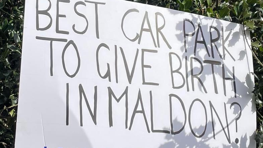 A protest sign at St Peter's Hospital in Maldon, which reads: "Best car park to give birth in Maldon?"