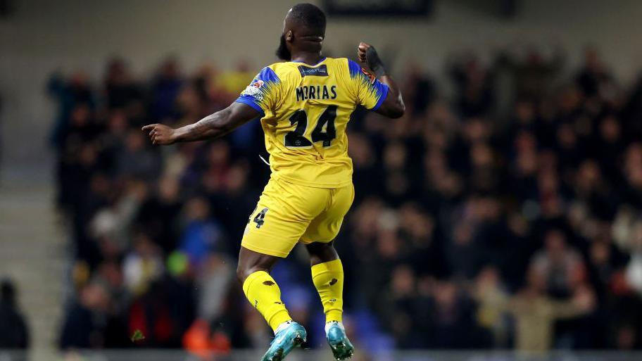 Junior Morias jumps for joy after scoring for Dagenham