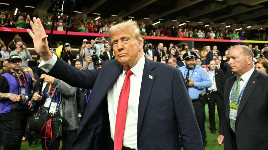 Donald Trump waves to the crowd at Super Bowl 59