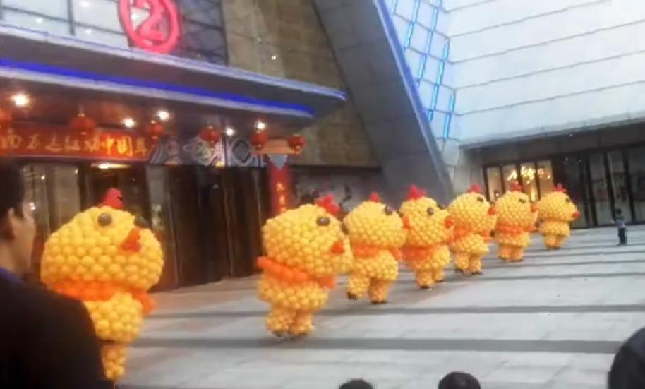 people dancing in Chicken costumes