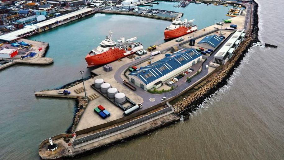 Aerial picture showing new port facilities at harbour with two large ships with red hulls docked beside the port