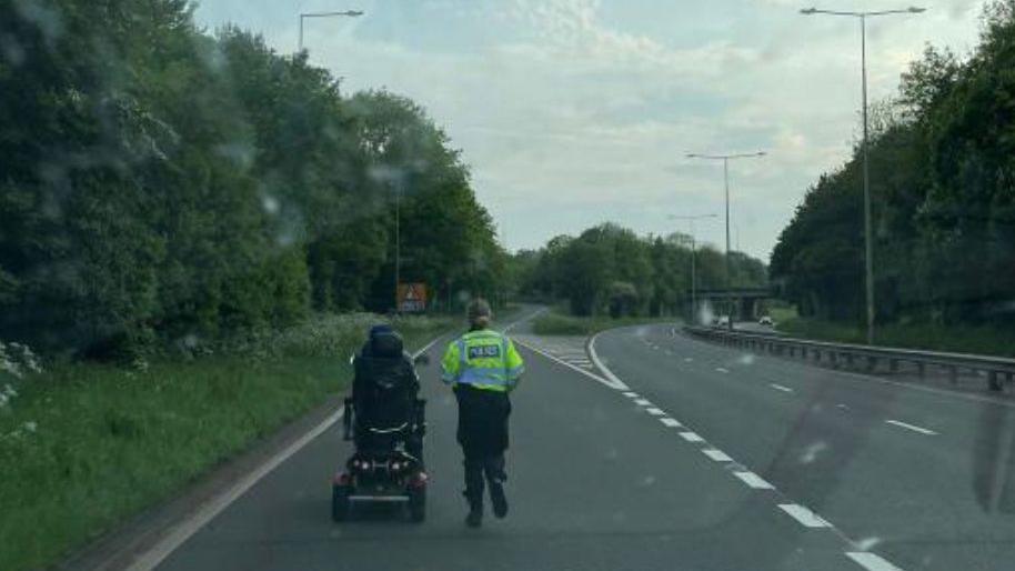 Police officer and mobility scooter