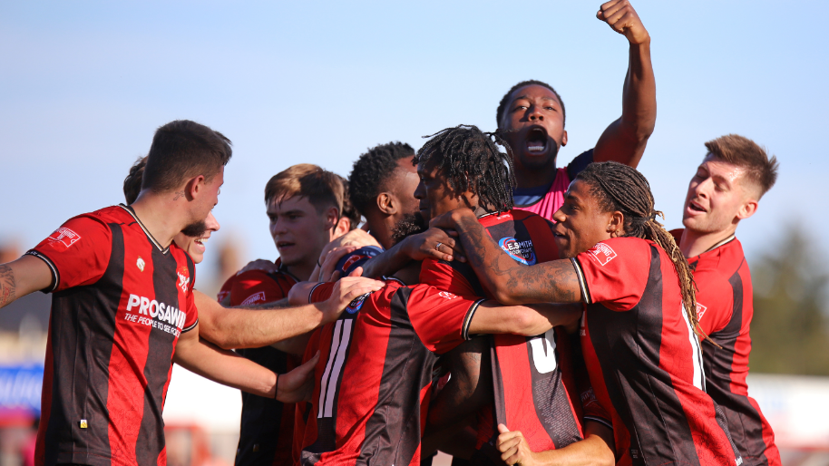 Kettering Town's players mob Nile Ranger (centre) after scoring against Cleethorpes Town in the second qualifying round of the FA Cup