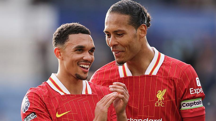 Liverpool's Trent Alexander-Arnold and Virgil van Dijk share a joke after last month's game against Leicester