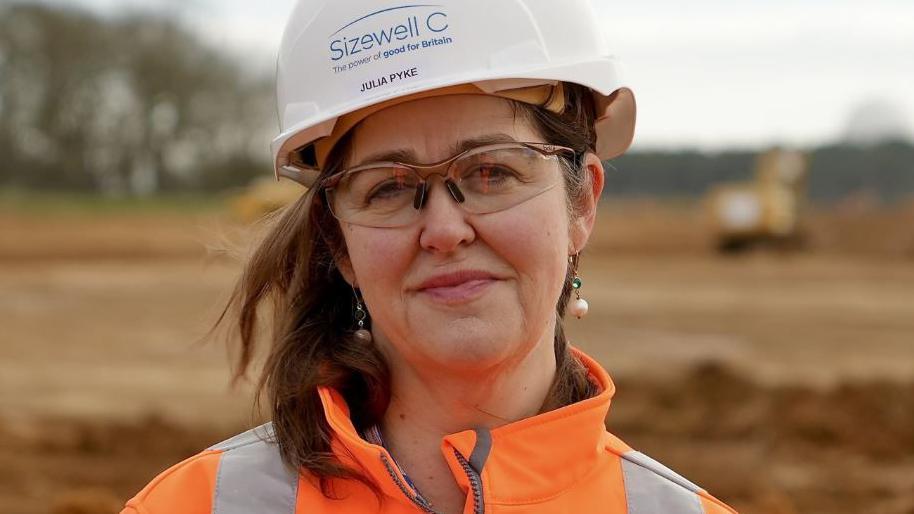 Julia Pyke wearing a hard hat at a visit to the site