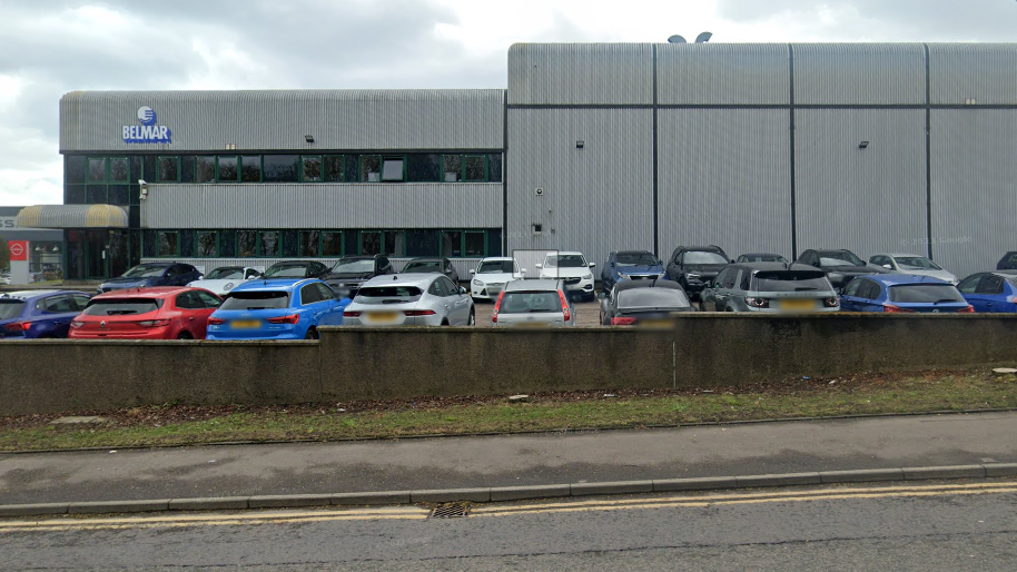 Belmar Engineering building with cars outside