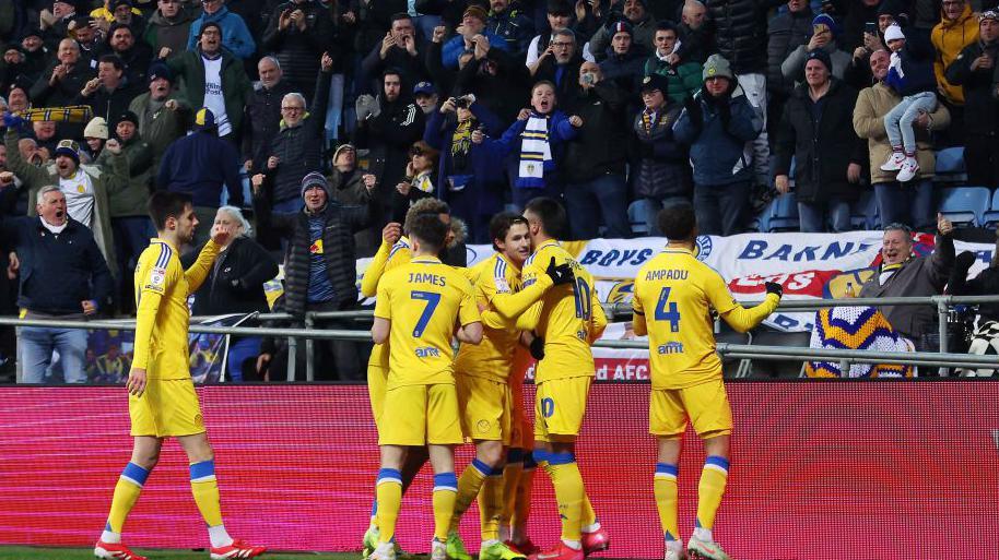 Leeds players celebrate Jayden Bogle's goal in front of the 3,000-strong away corner   