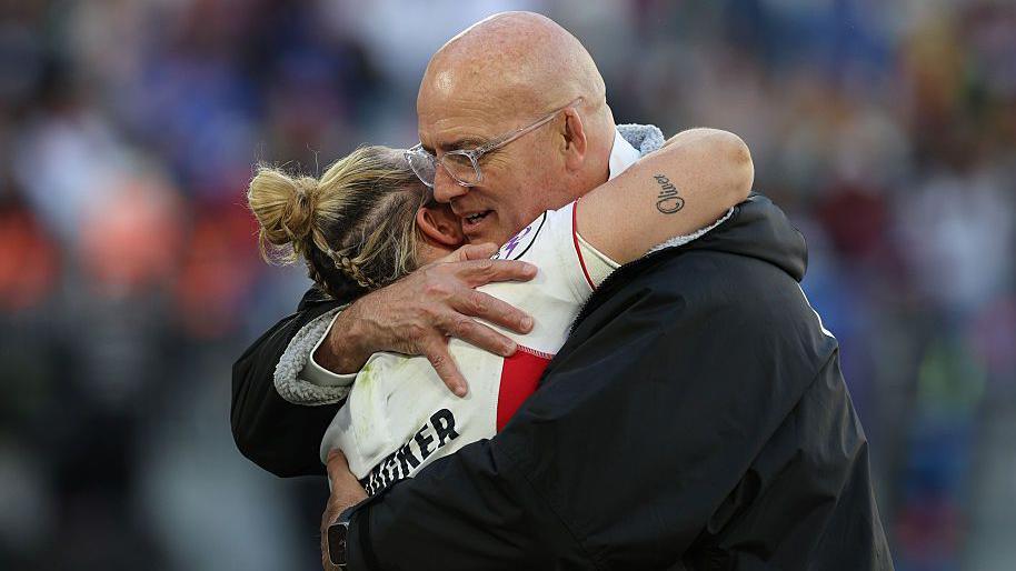 John Mitchell hugs Marlie Packer