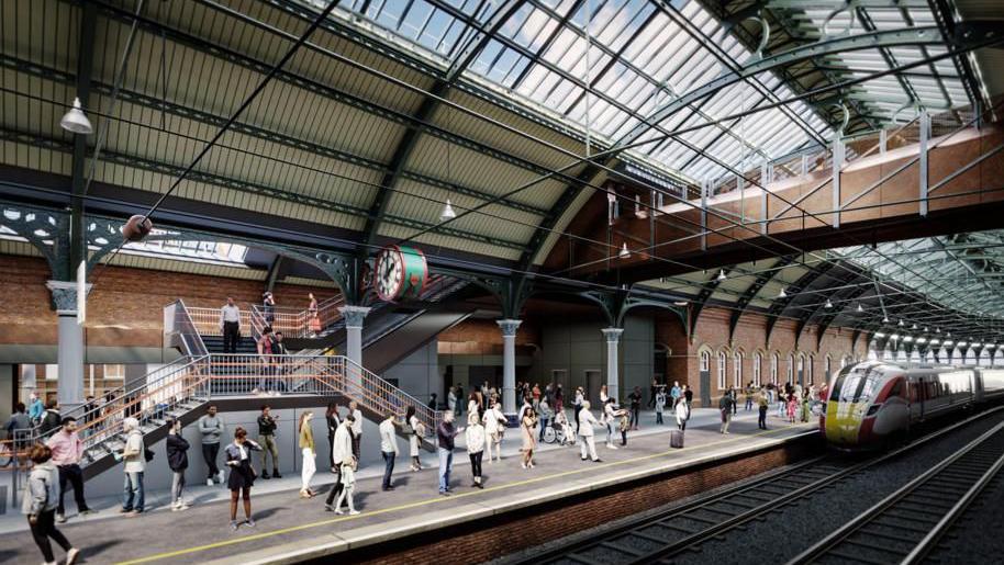 A computer generated image of Darlington station how it will look after a redevelopment. Lots of people are on the platform and a train is coming in. A new footbridge goes across the line with a staircase going up to it 