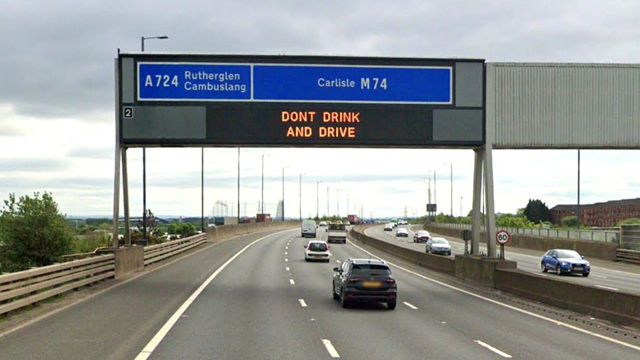 A screengrab of the M74 motorway. The sign shows the junction 2 exit at Rutherglen and Cambuslang.