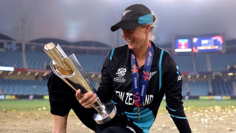 Sophie Devine looking at the T20 World Cup trophy in Dubai