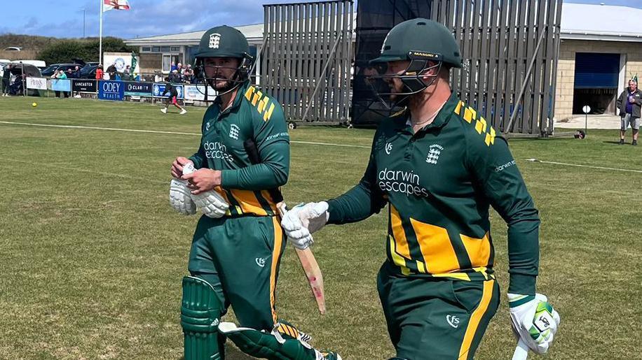 Guernsey's openers Ben Fitchet and and Josh Butler head to the crease