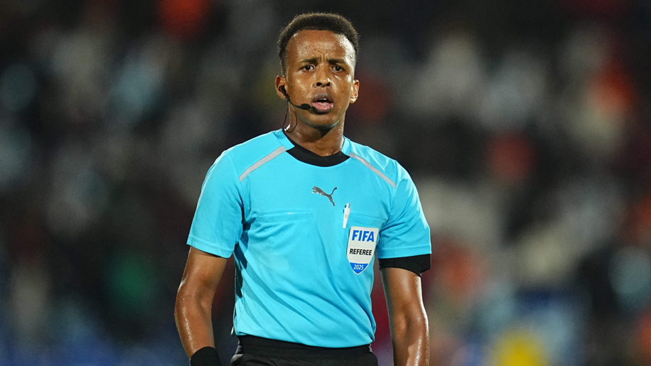 Omar Artan in blue Fifa referee kit
