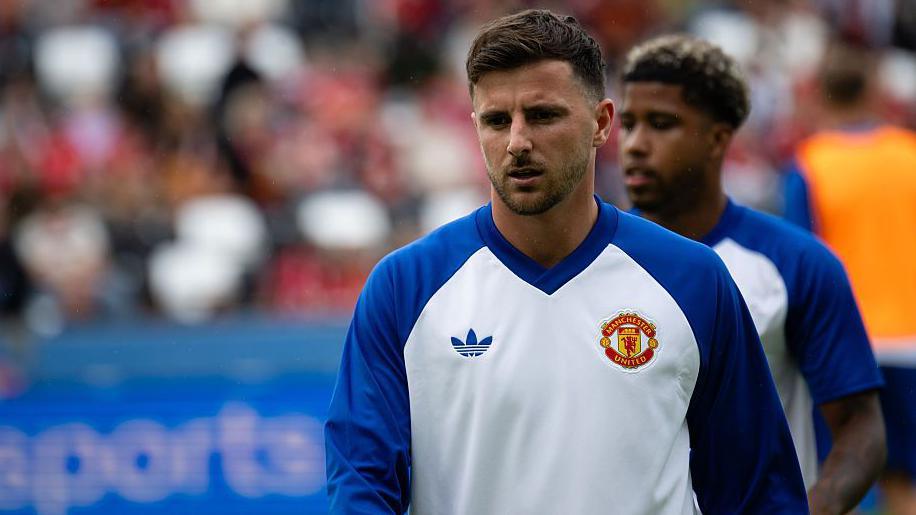 Mason Mount during the warm-up. Andrey Santos is out of focus behind him.