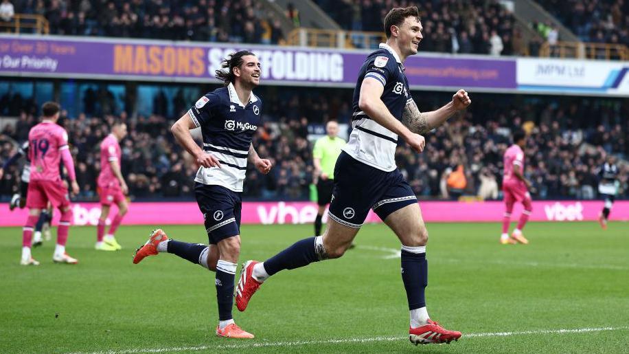 Jake Cooper [right] celebrates after scoring for Millwall against West Bromwich Albion