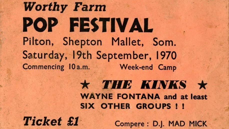 An orange poster advertising the Pilton Pop, Folk and Blues Festival. The poster says "Worthy Farm Pop Fesitval, Pilton, Shepton Mallet, Som. Saturday, 19th September, 1970. The Kinks and Wayne Fonta are billed on the lineup. The poster says that tickets cost £1.