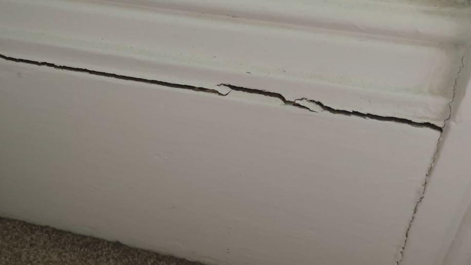 A tall skirting board is severely cracked in one of the Wilson's bedrooms.