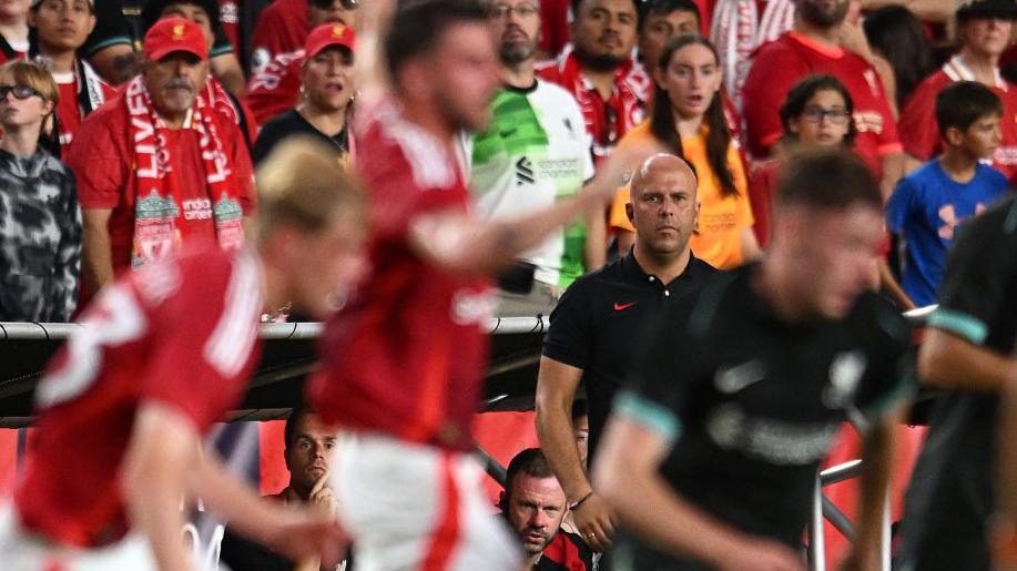 Liverpool boss Arne Slot looks on during the friendly with Manchester United