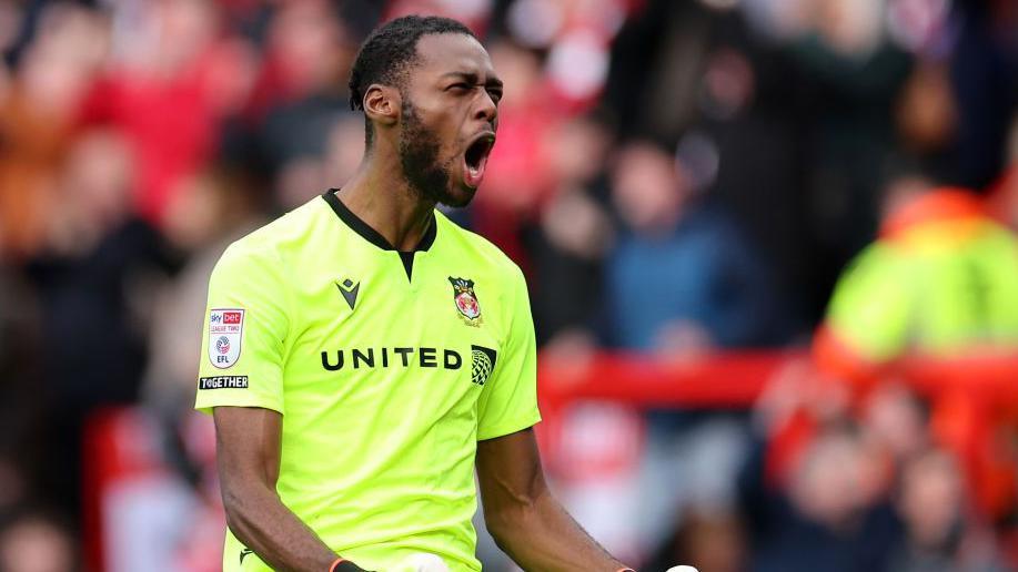 Arthur Okonkwo celebrates during a Wrexham game