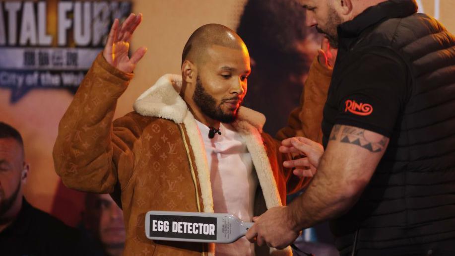 Chris Eubank Jr being scanned by an 'egg detector'