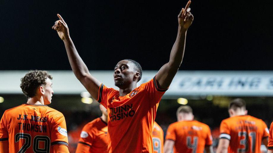 Dundee Untied's Emmanuel Adeboyega celebrates as he scores to make it 2-0