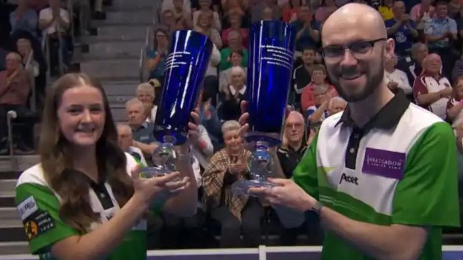 Beth Riva and Jason Banks with their trophies