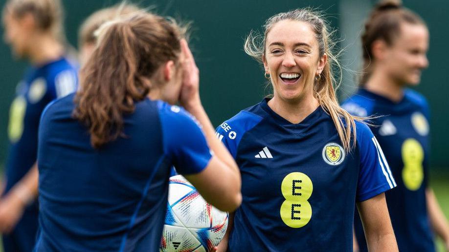 Lisa Evans enjoys a lighthearted moment at Scotland training