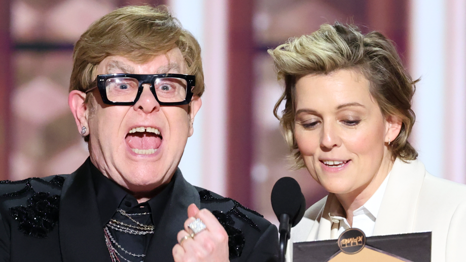 Elton John and Brandi Carlile presenting an award