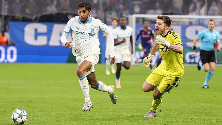 Pierre-Emerick Aubameyang gets to the ball before Nick Pope to equalise for Marseille against Newcastle United at Stade Velodrome on 25 November, 2025