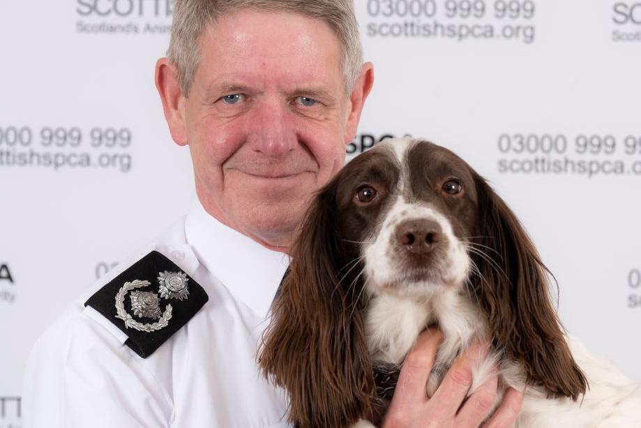 Mike Flynn of the Scottish SPCA and a dog