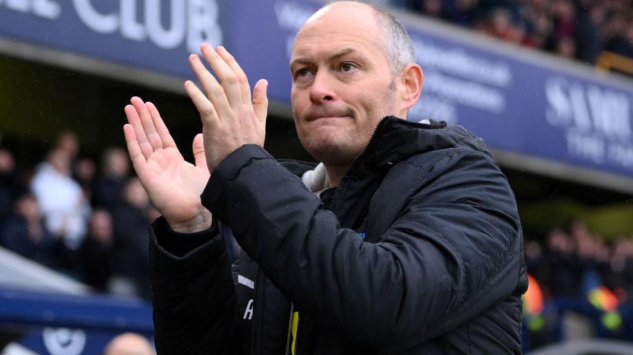 Alex Neil claps the Millwall fans