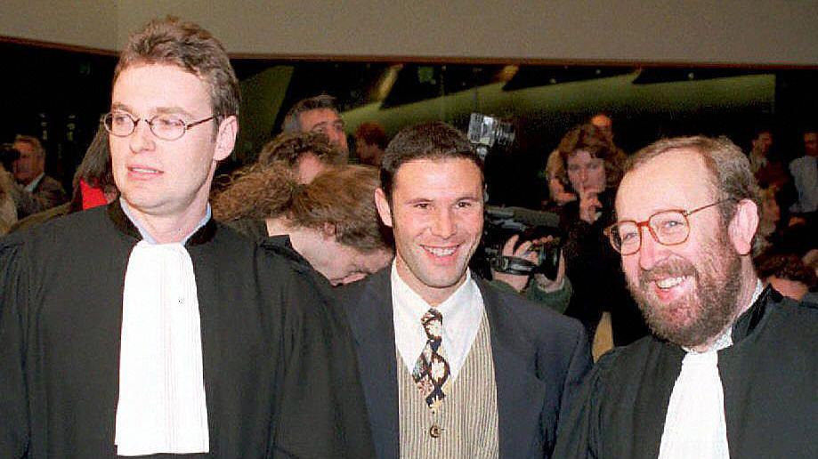 Jean-Marc Bosman (centre) and two of his lawyers Luc Misson (right) and Jean-Louis Dupont (left)