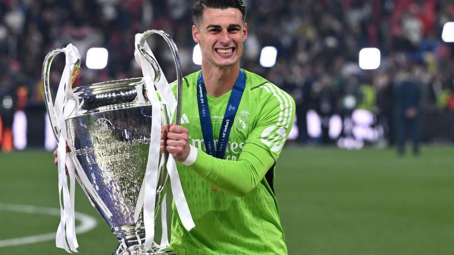 Kepa Arrizabalaga with the Champions League trophy which he won while on loan at Real Madrid last season.